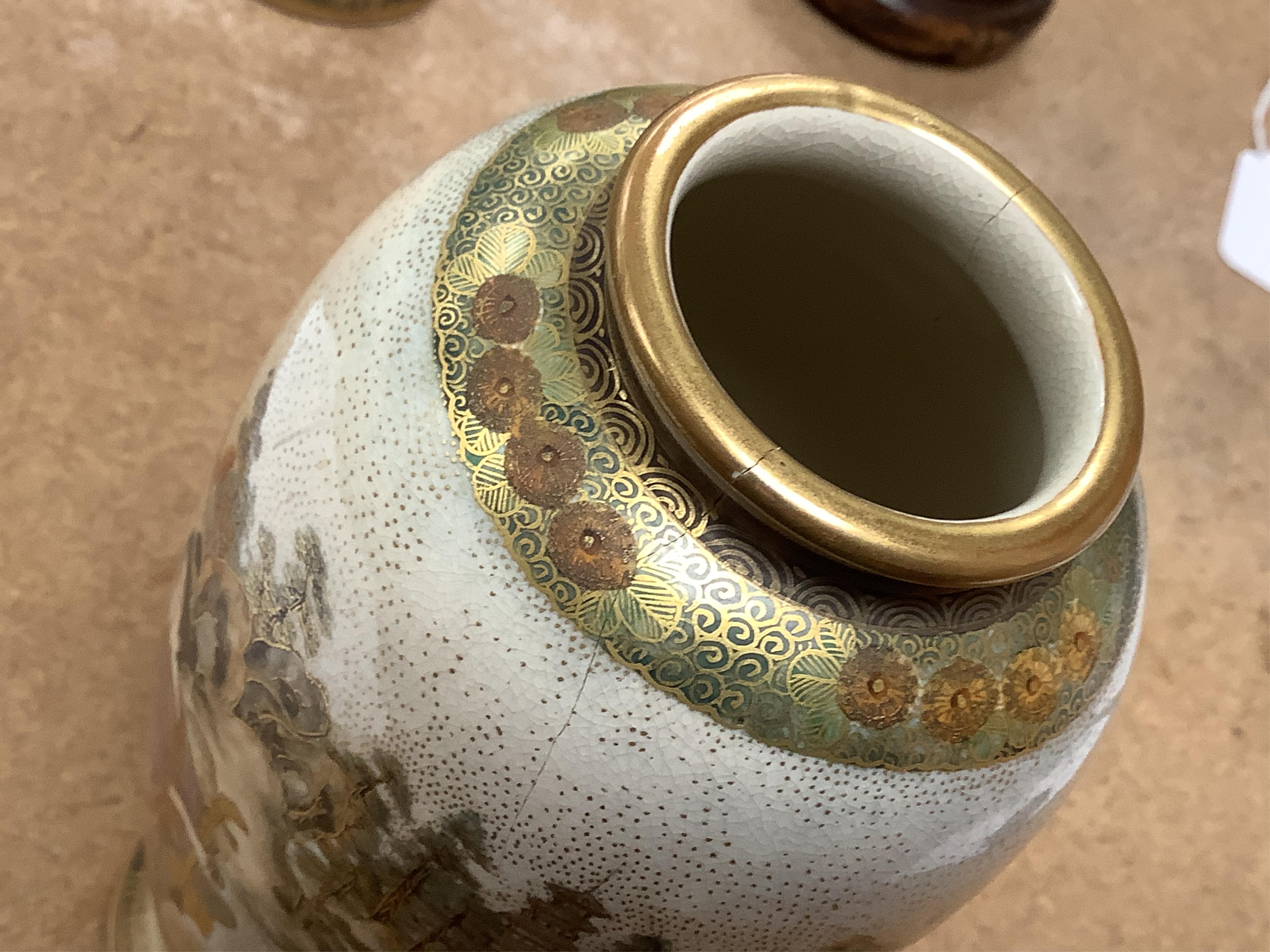 A pair of Japanese satsuma vases and stands, signed, Meiji period (1868-1912), 21cm total